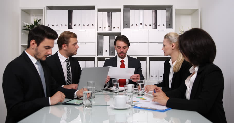 Group of office workers in a boardroom presentation